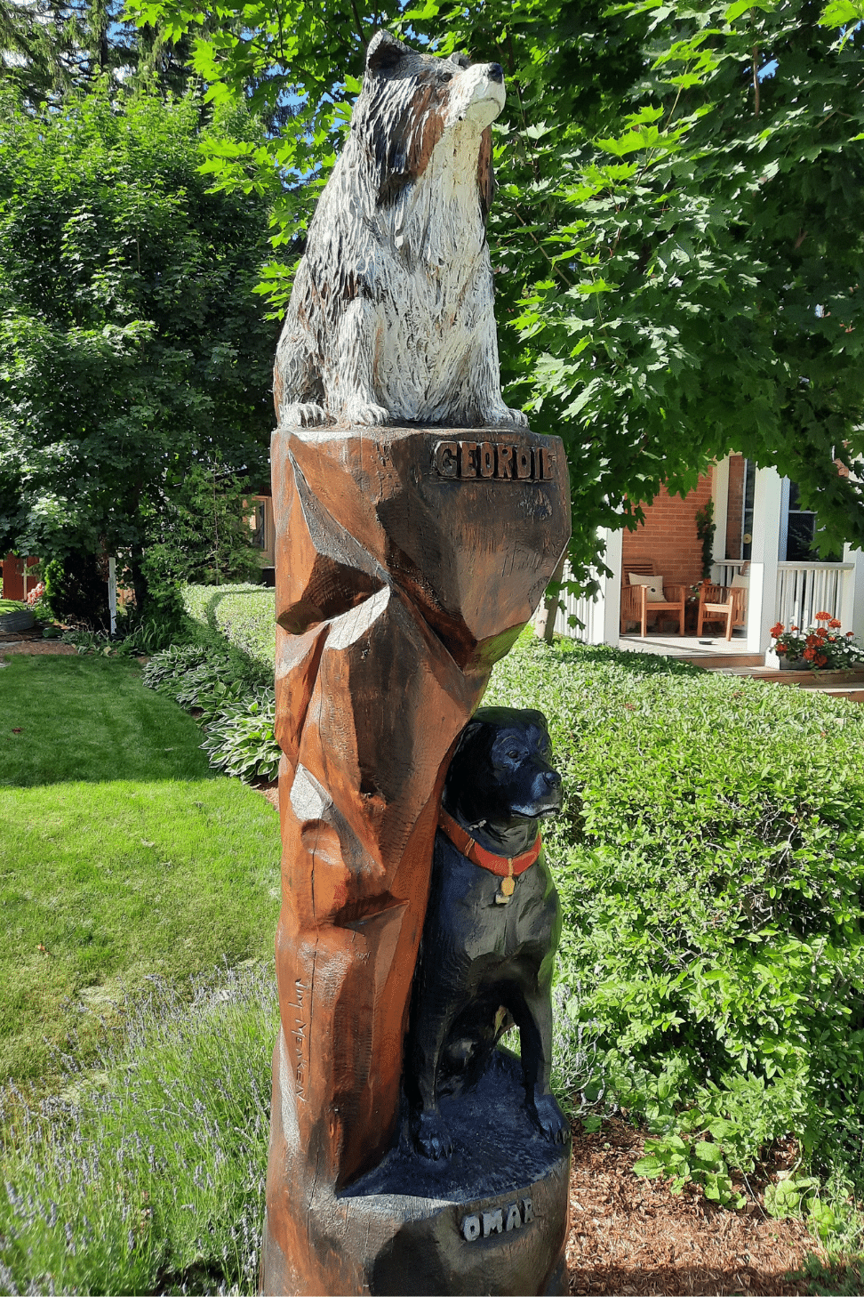 Tree sculpture of two dogs